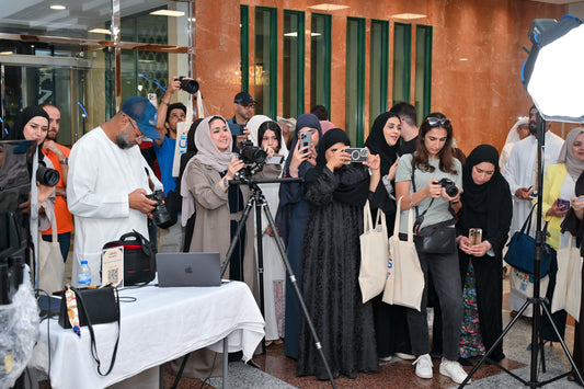 Group photo of attendees at the UBMS Family Portrait Photography Workshop in Sharjah